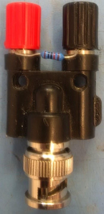 Figure 5. A 10kOhm resistor tied around the output of a BNC to screw terminal adaptor to measure output from 701C stimulator.